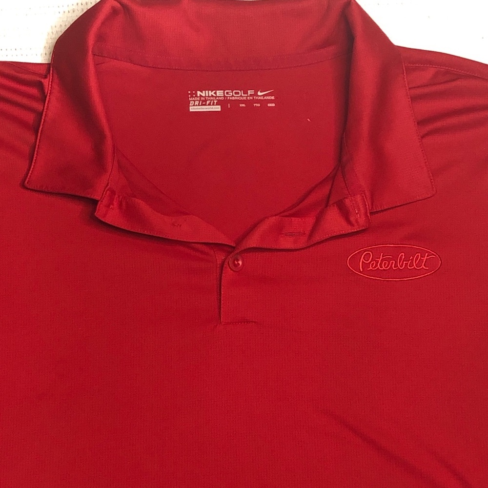 This is a nice shirt it has one small hole in the upper back